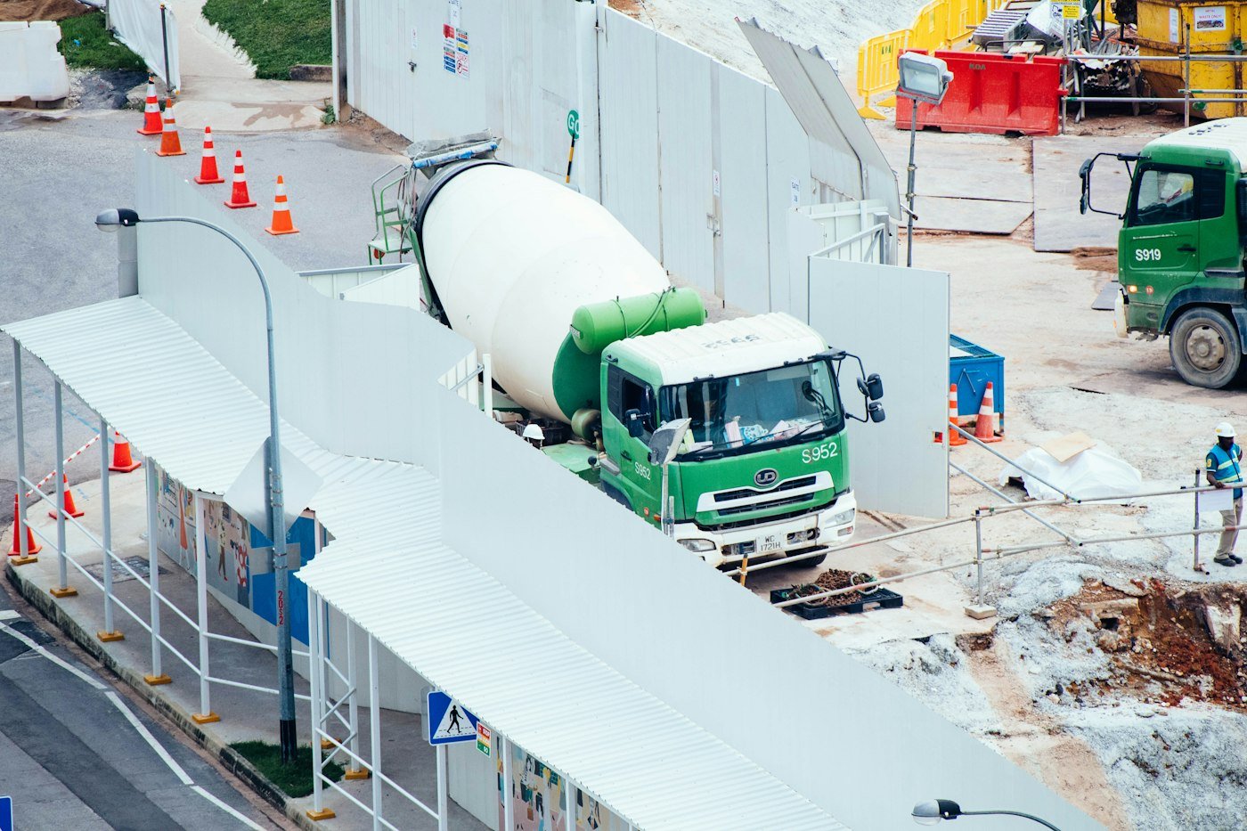 Concrete mixer truck loading at a batching plant construction site