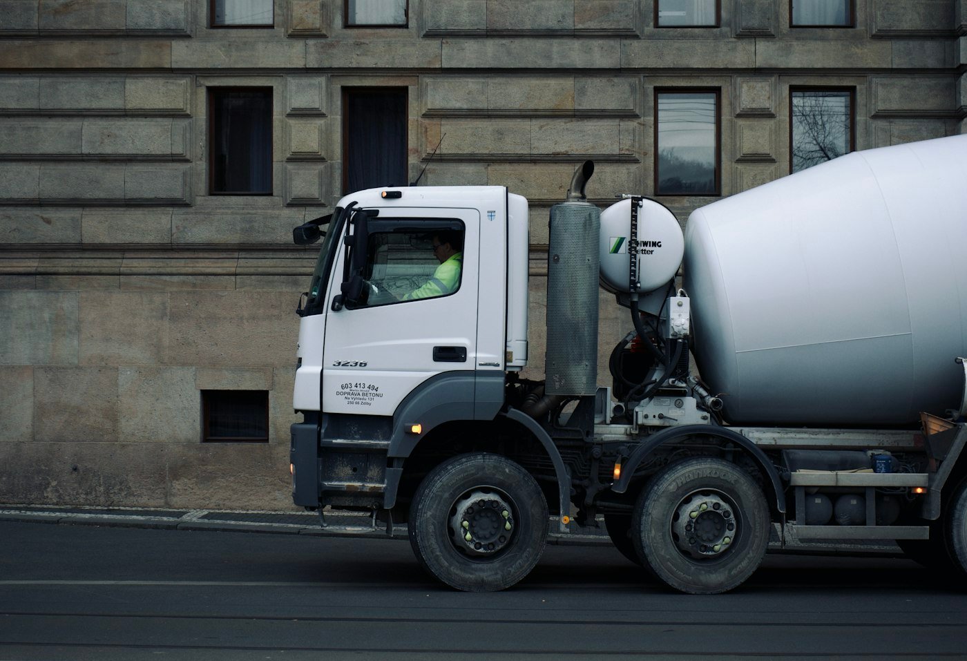 Concrete mixer truck en route to a construction site delivery